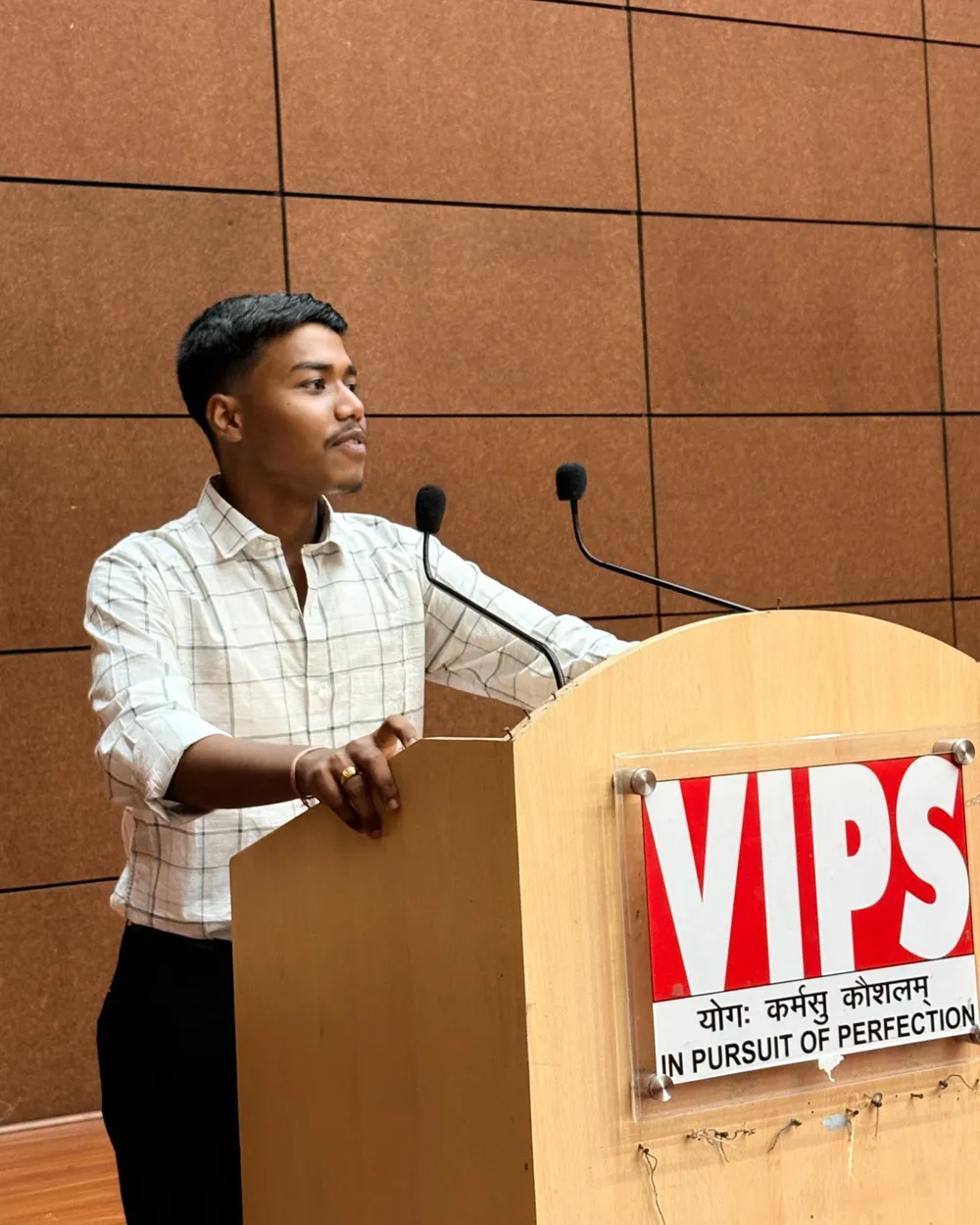 Speaking at the podium at VIPS